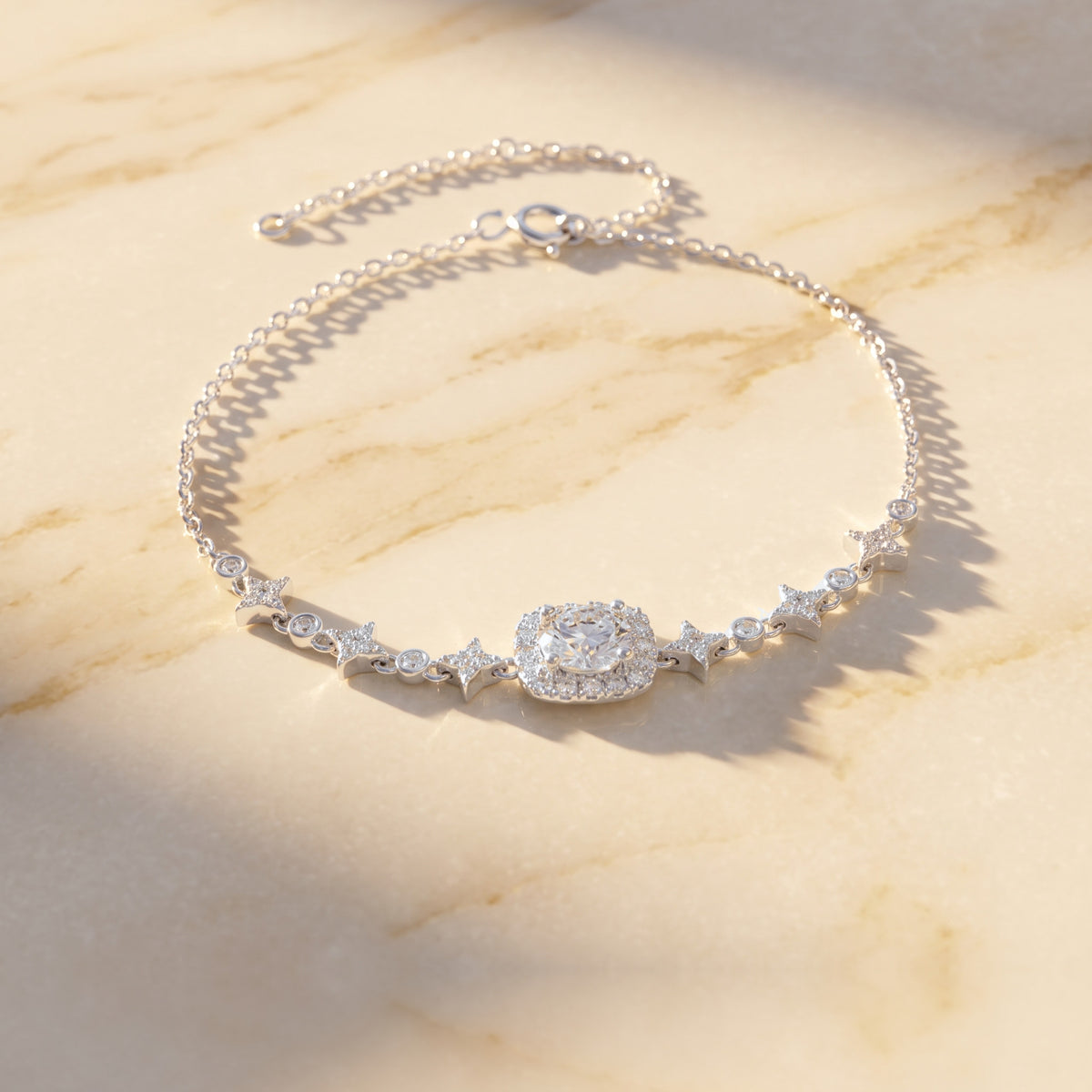 On warm cream marble with sunlight and soft shadows, a luxury feel.