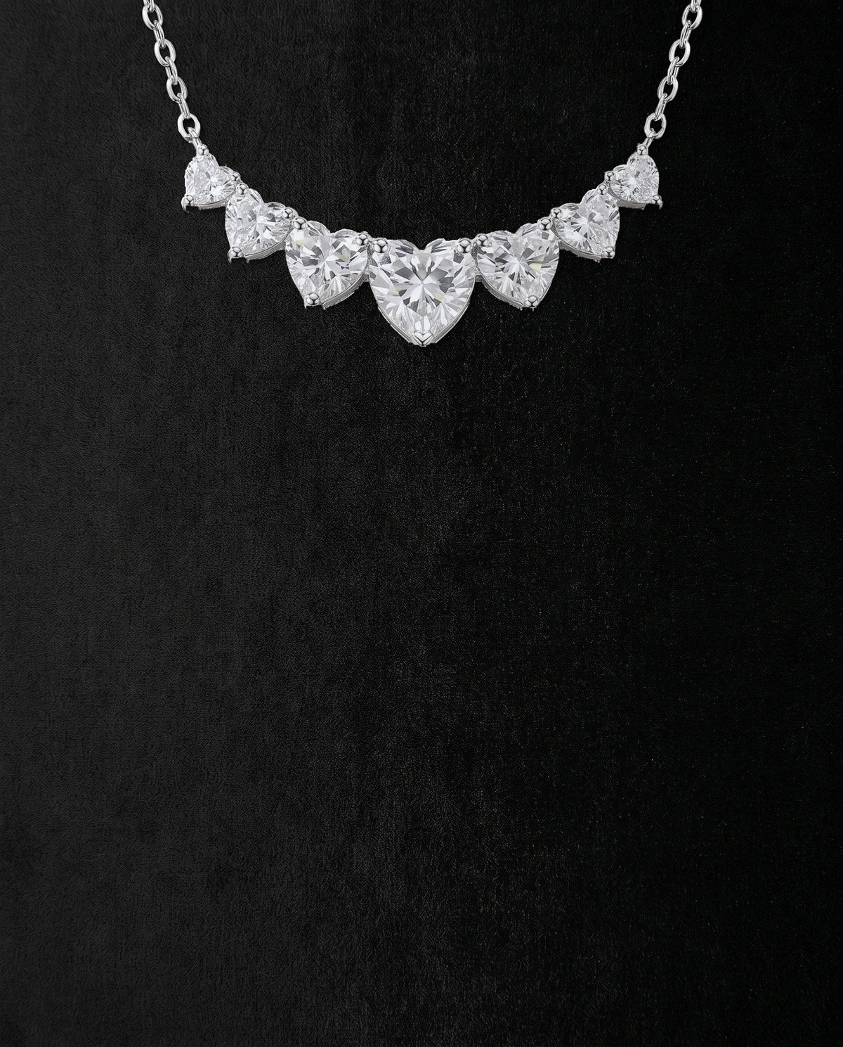 Seven hearts, each in prongs